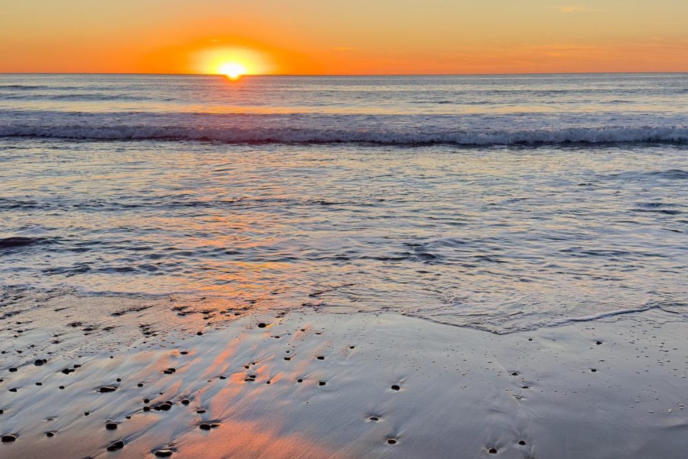 Sunset view of the Carlsbad California coastline in North County San Diego