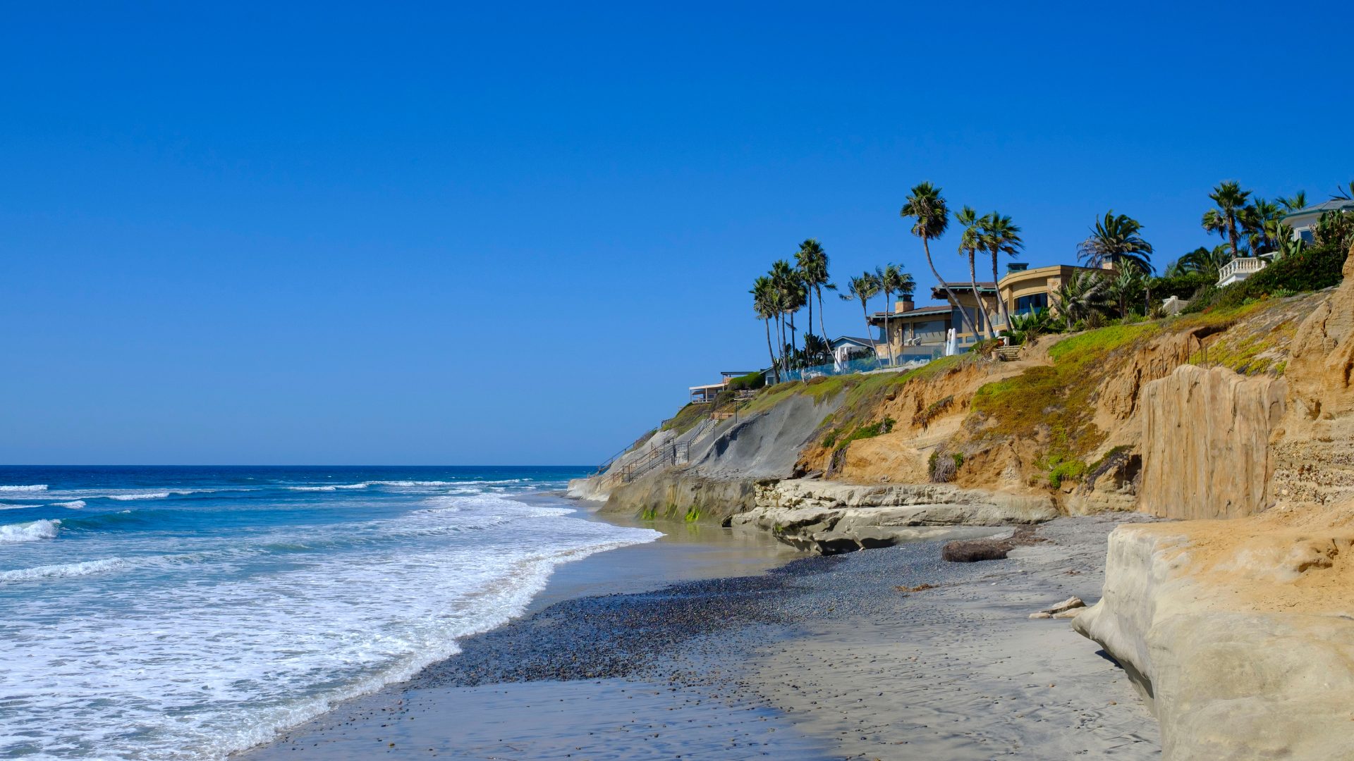 Carlsbad, California coastline with oceanfront homes on the bluffs above the beach in North County San Diego