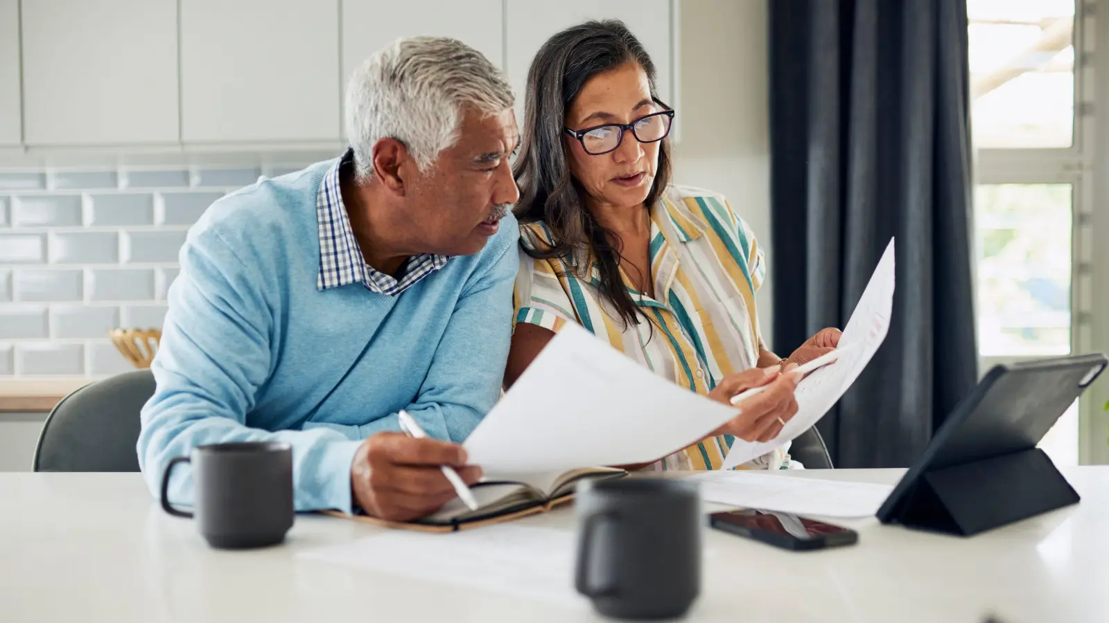 Home buyers reviewing mortgage options with a lender in North San Diego County
