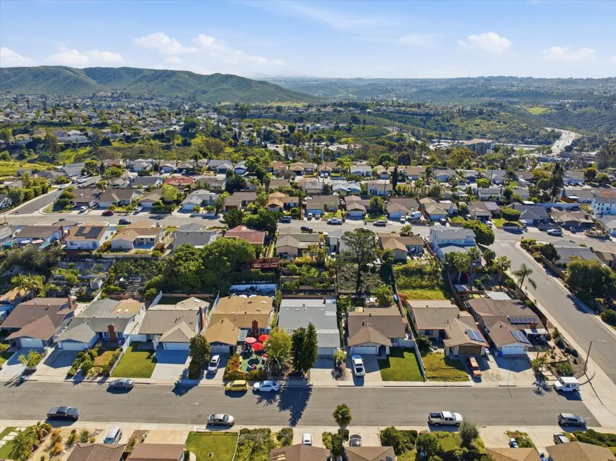 Aerial view of Rancho Peñasquitos neighborhood showing established homes, nearby amenities, and surrounding hills in North County San Diego