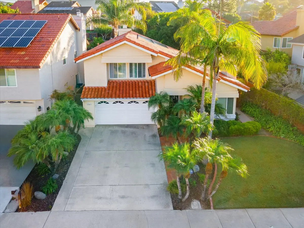 Exterior of a San Diego home with a two-car garage and palm trees