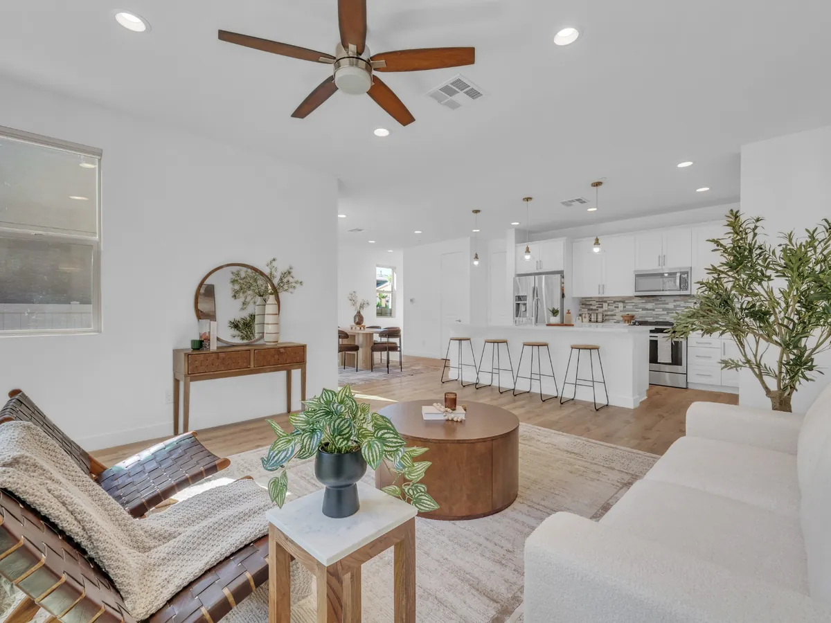 Bright, staged open-concept living room and kitchen