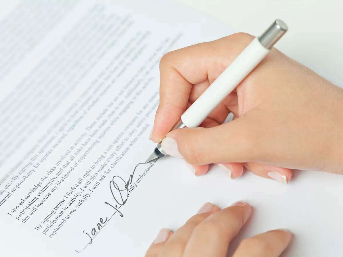 Home seller signing escrow and disclosure documents