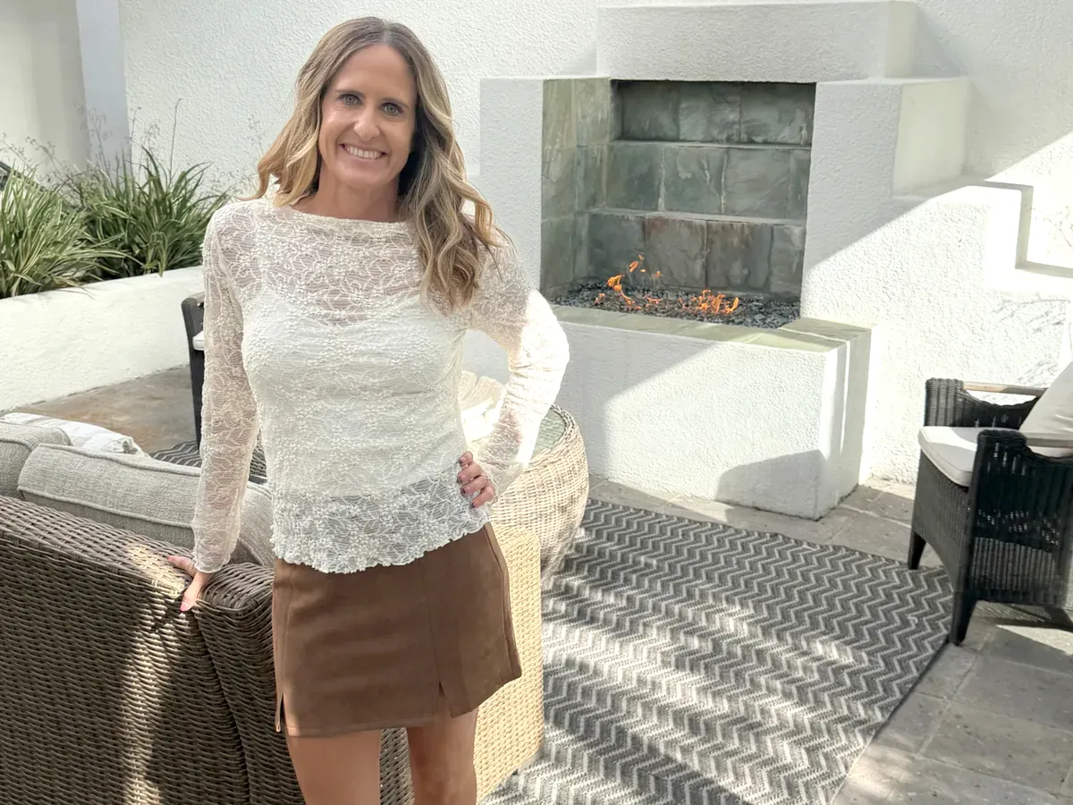 Karen Pietsch at a North County home showing on the patio by the fireplace